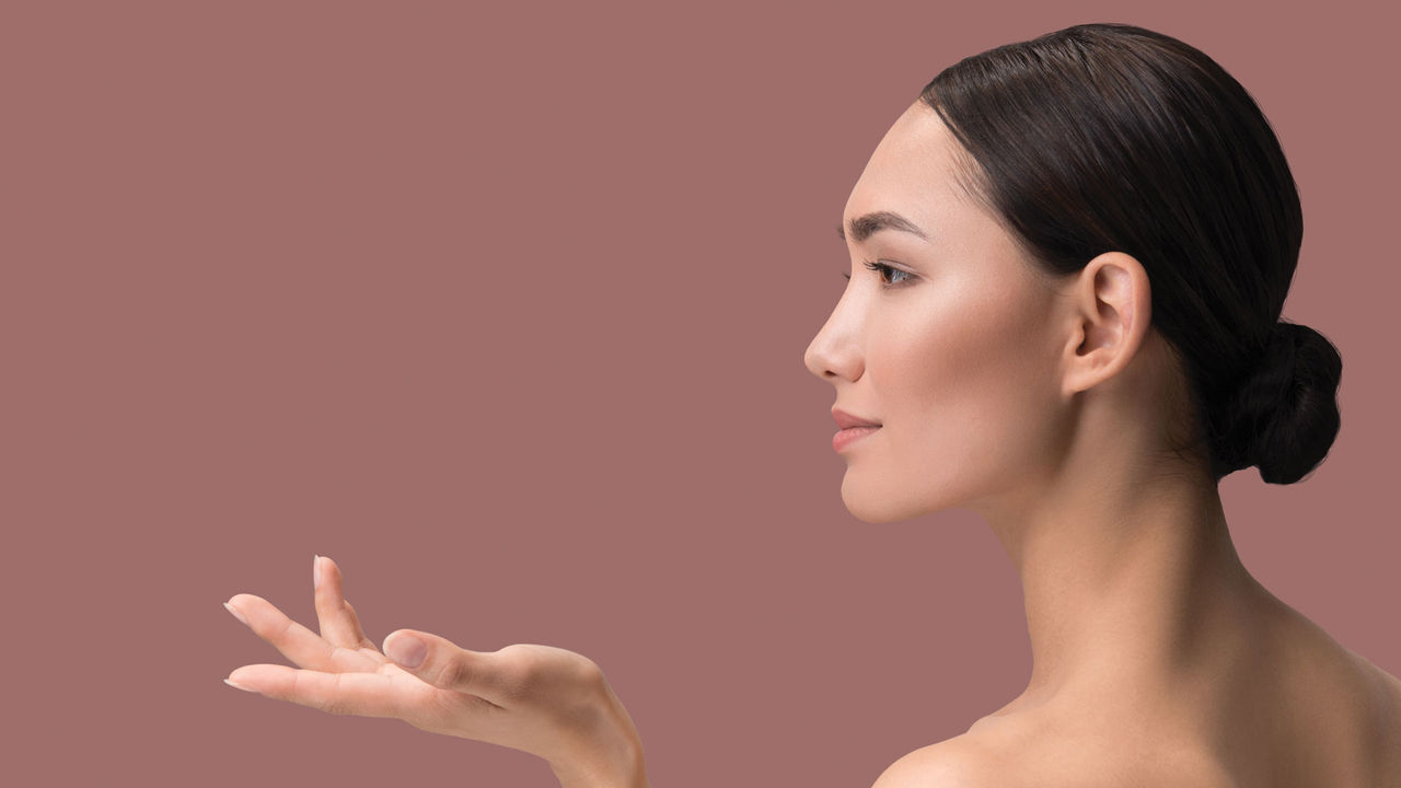 Image of a woman reaching her hand out with her palm facing up